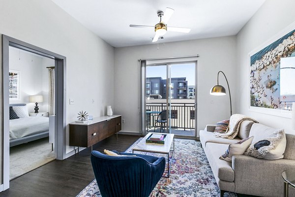 Spacious living room with modern decor in West Village Apartments, luxury residences by Greystar