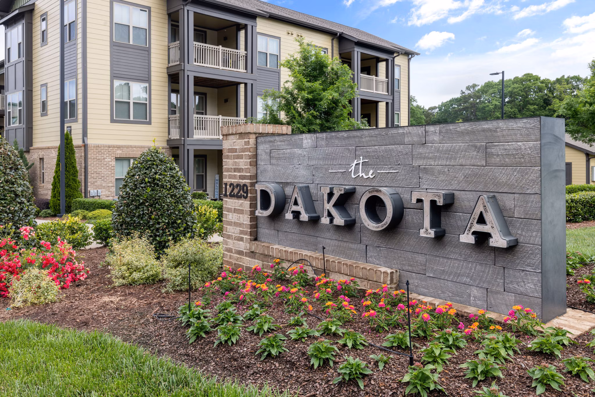 Dakota Apartments: Signage at luxury apartment complex in a desirable urban setting