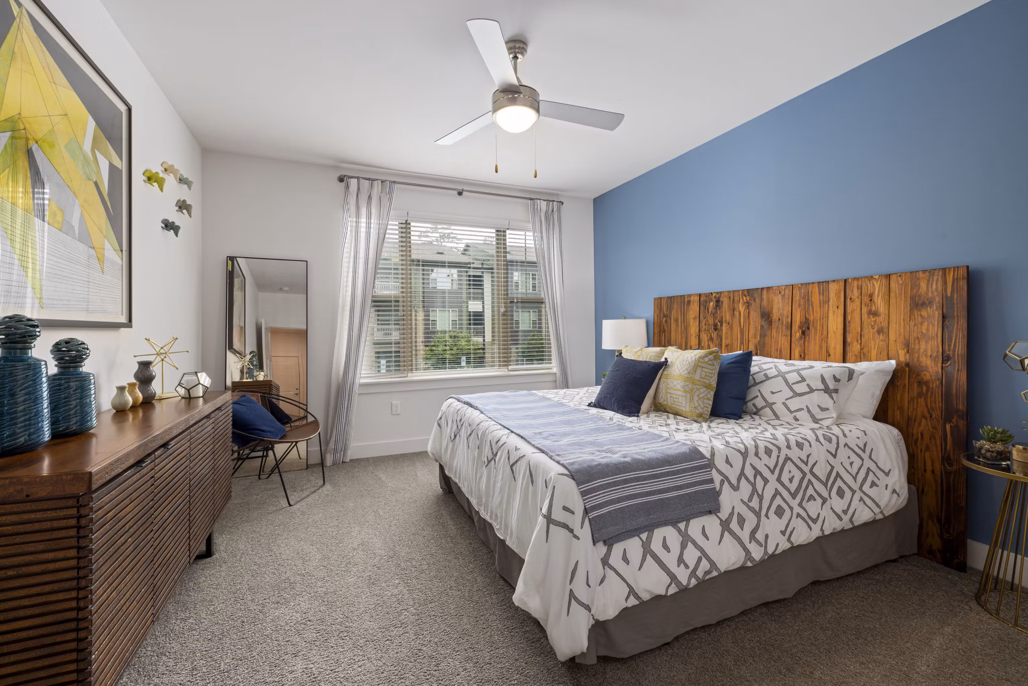 Spacious bedroom with modern decor at The Dakota Apartments, a luxury property offering exceptional living spaces