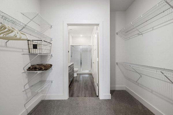 Cozy bedroom with modern decor at The Dakota Apartments luxury community