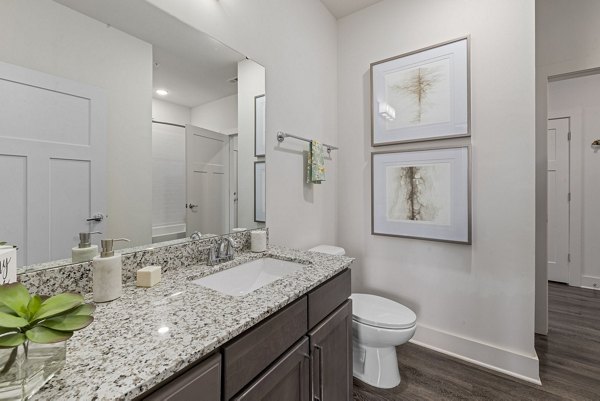 Bathroom featuring sleek fixtures and modern design in The Dakota Apartments