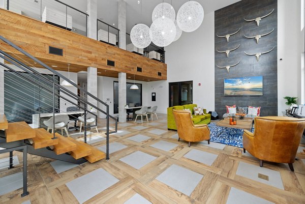 The Dakota Apartments: Stylish clubhouse with modern decor and comfortable seating in upscale community