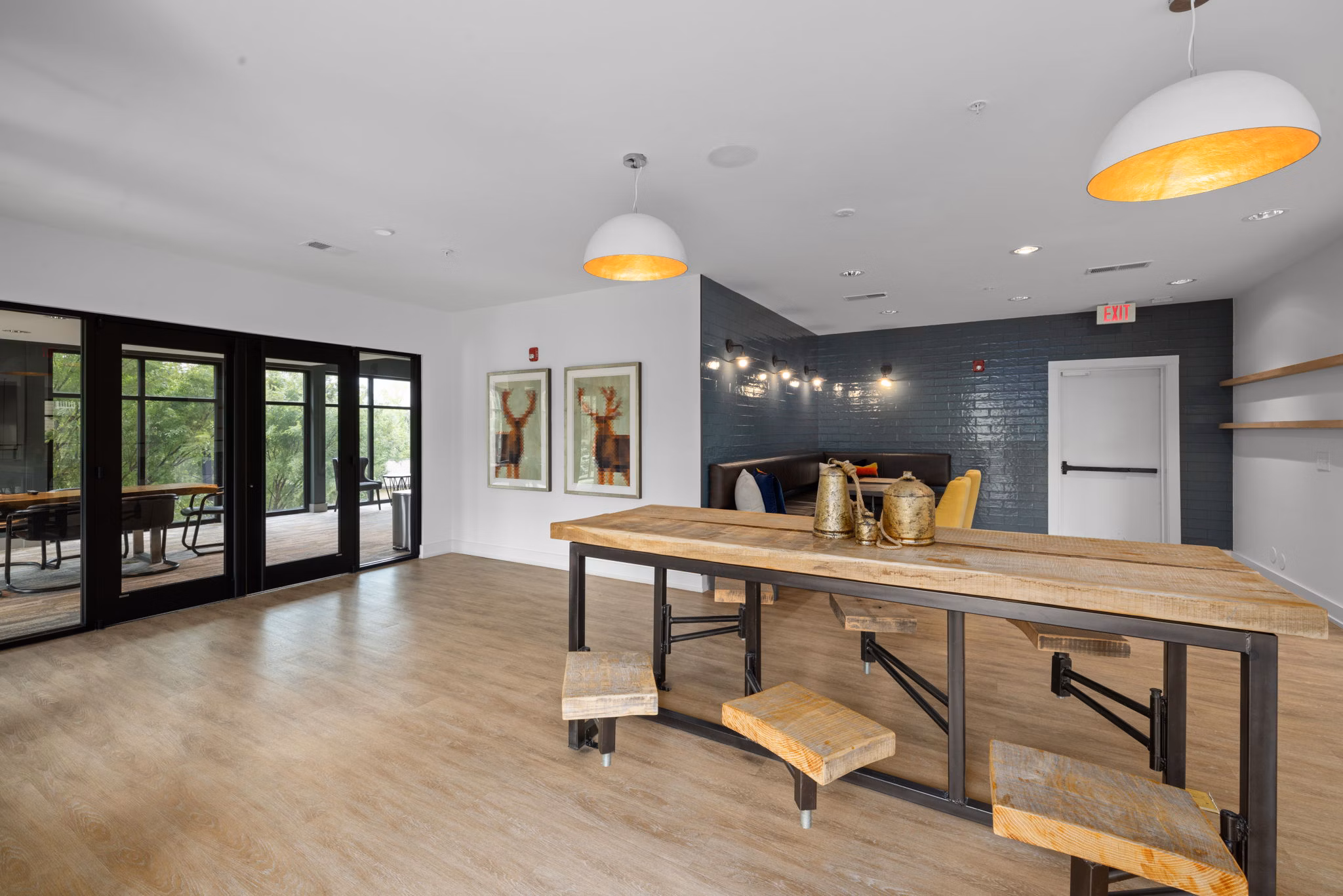 Stylish clubhouse with elegant decor at The Dakota Apartments, offering luxury amenities for community gatherings and events