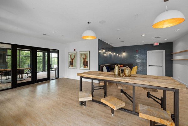 Stylish clubhouse with elegant decor at The Dakota Apartments, offering luxury amenities for community gatherings and events