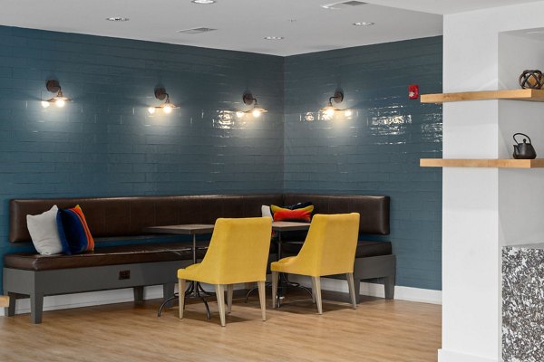 Clubhouse featuring modern decor and seating at The Dakota Apartments, a luxury Greystar property