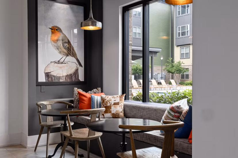 Stylish club house at The Dakota Apartments featuring modern design and ample seating for luxury living