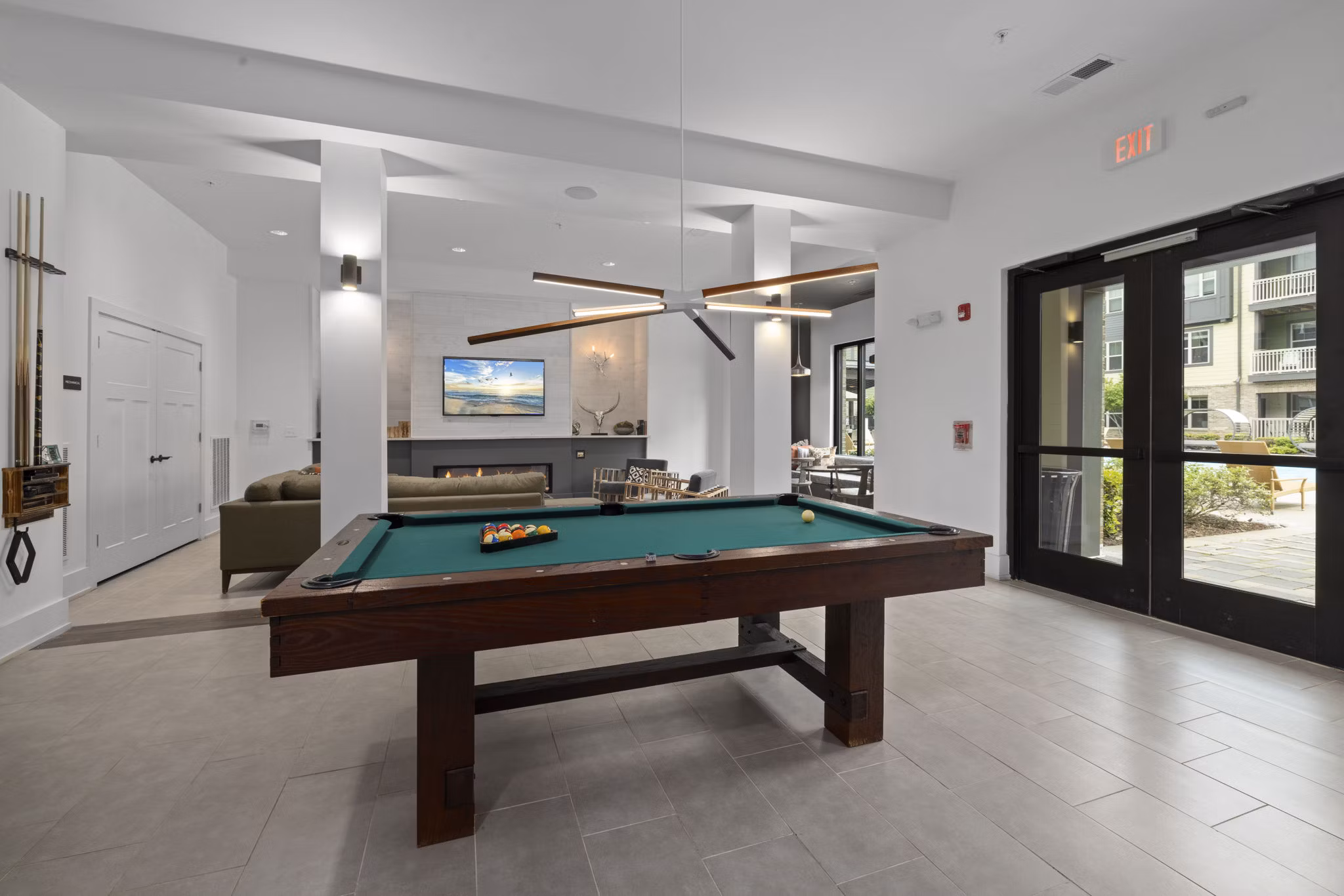Gaming room with modern consoles and seating at The Dakota Apartments