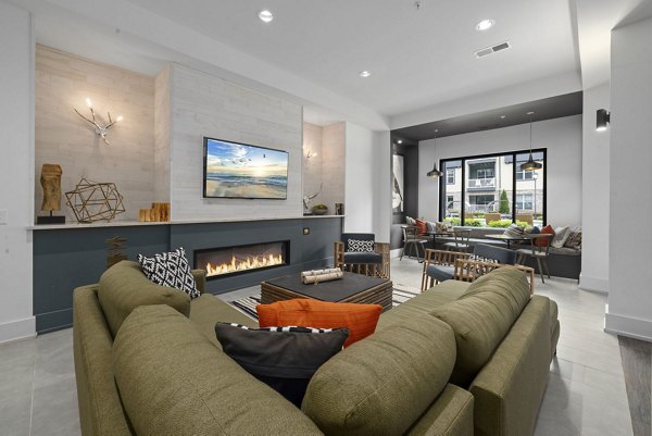 The Dakota Apartments: Elegant clubhouse with modern dÃ©cor and plush seating for social gatherings