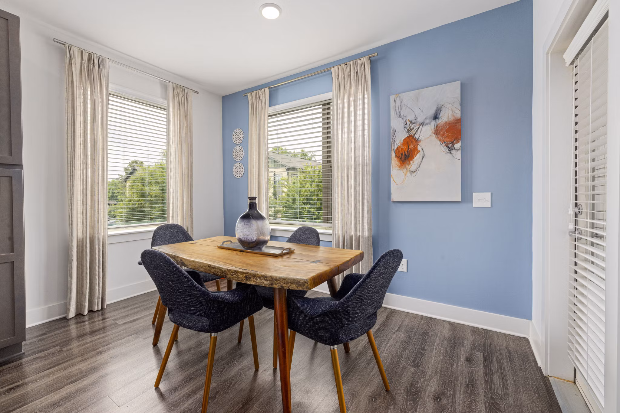 Dining area with elegant decor and modern furnishings at The Dakota Apartments, a luxury community by Greystar