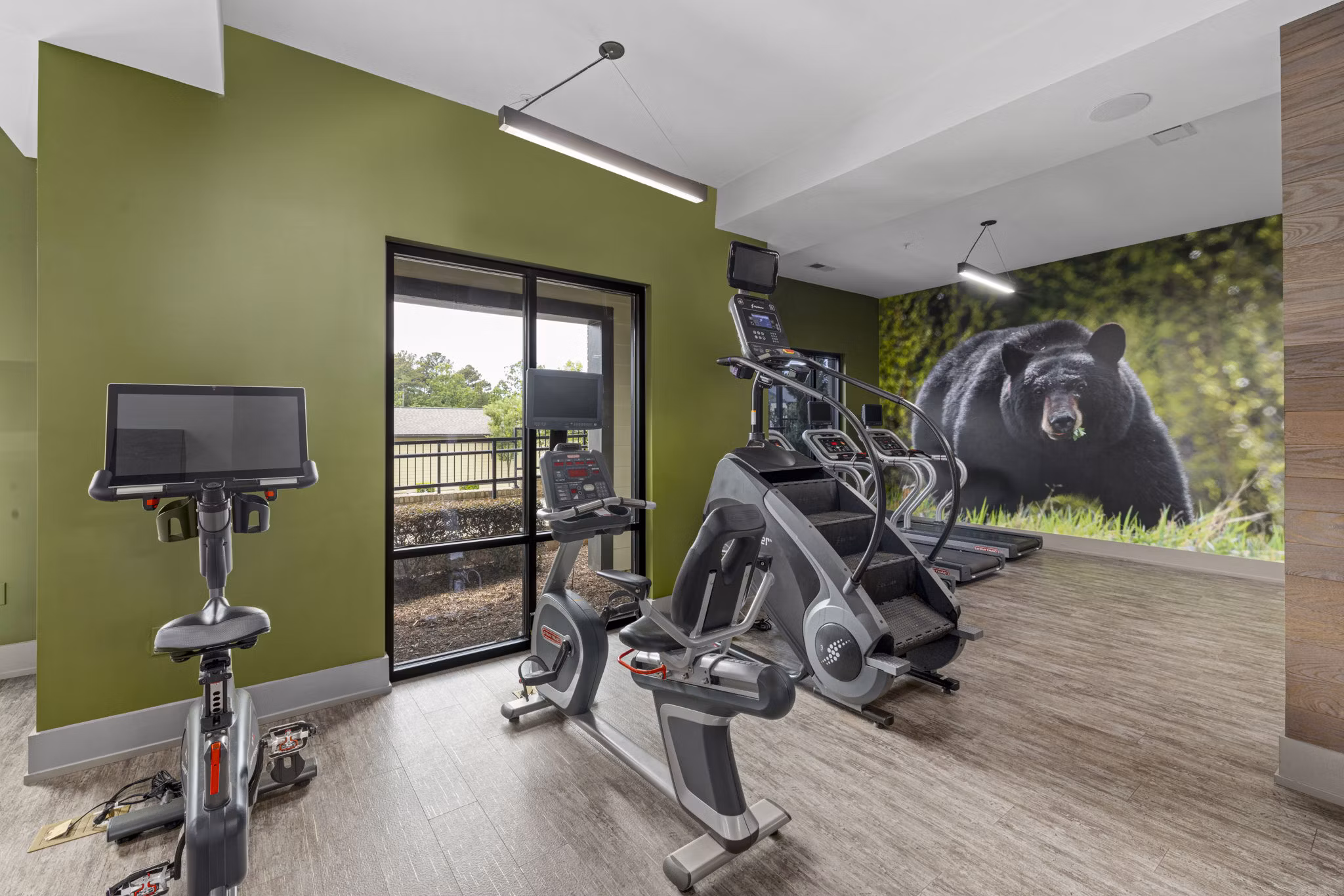 Modern fitness center with state-of-the-art equipment at The Dakota Apartments, perfect for luxury living and active lifestyles in urban settings