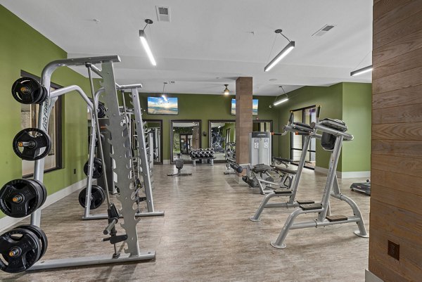 State-of-the-art fitness center featuring modern equipment at The Dakota Apartments