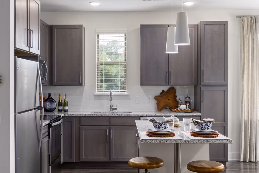 Kitchens with stainless steel appliances at The Dakota Apartments
