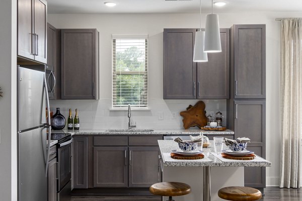 Kitchens with stainless steel appliances at The Dakota Apartments