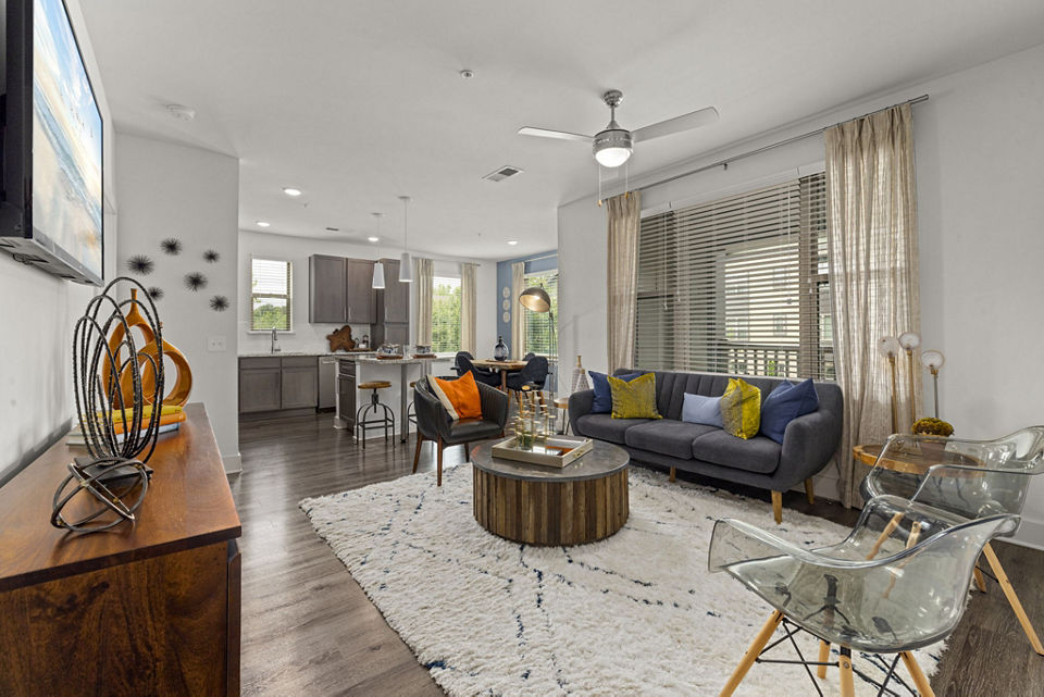 Spacious living room with modern decor in The Dakota Apartments