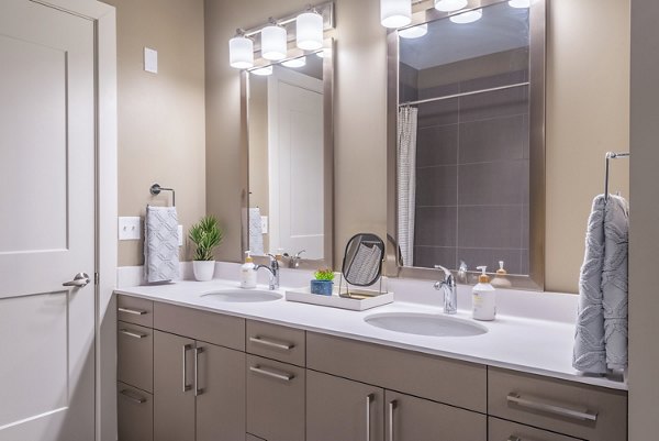 Modern bathroom with sleek fixtures and marble countertops in Elan Yorktown Apartments