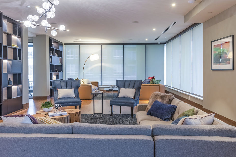 Clubhouse lobby with modern decor and seating at Elan Yorktown Apartments