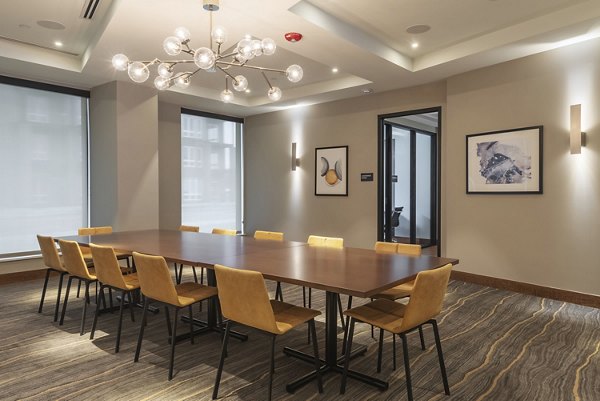 Clubhouse meeting facility with modern amenities at Elan Yorktown Apartments, ideal for gatherings and business meetings