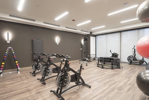 Modern yoga and spin studio with state-of-the-art equipment at Elan Yorktown Apartments