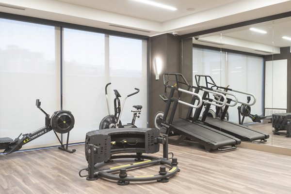 State-of-the-art fitness center with modern equipment at Elan Yorktown Apartments, offering luxury amenities for active residents