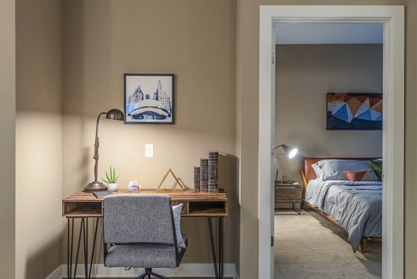 Home office and bedroom with modern decor elements in Elan Yorktown Apartments