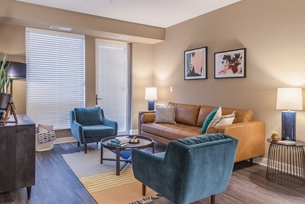 Spacious living room with contemporary furnishings in Elan Yorktown Apartments