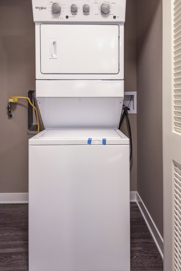 Modern laundry room with high-efficiency washers at Elan Yorktown Apartments