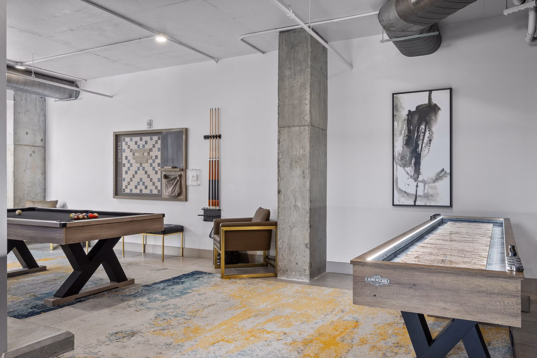 Game room with billiards and lounge area at Republic Flats Apartments