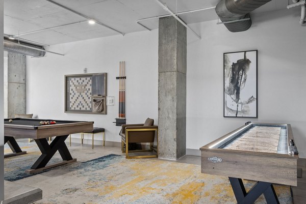 Game room with billiards and lounge area at Republic Flats Apartments