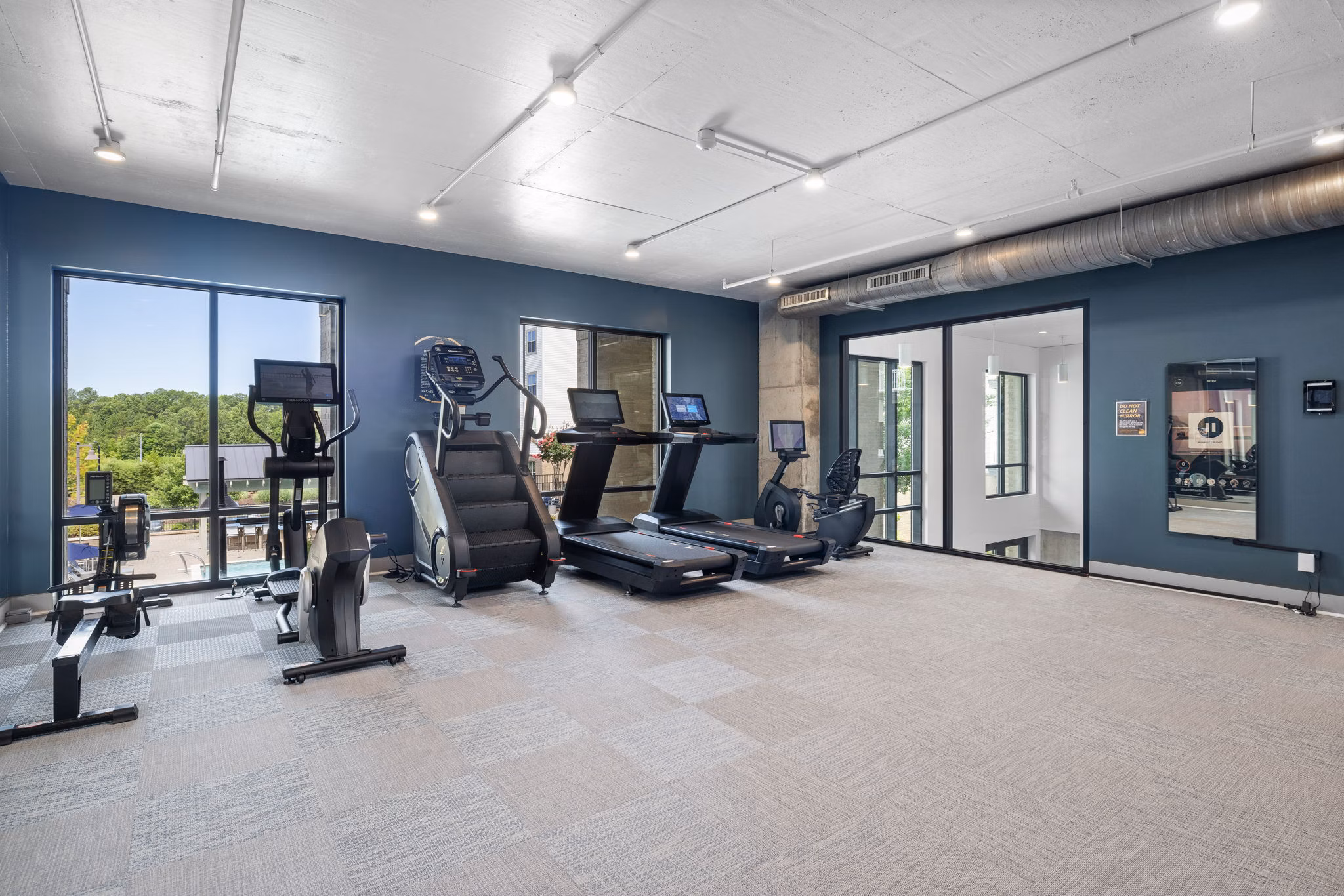 State-of-the-art fitness center with weight and cardio machines at Republic Flats Apartments