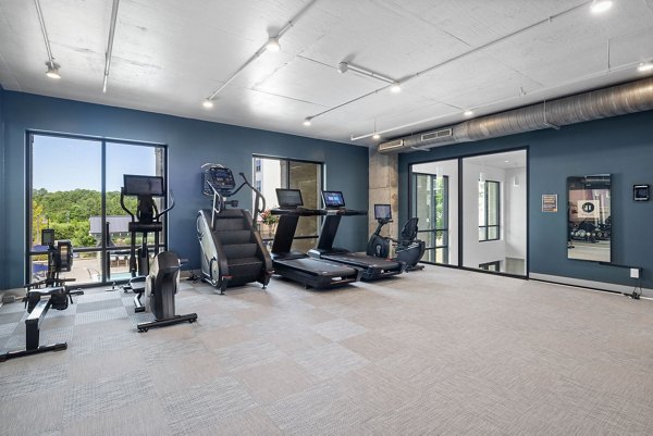 State-of-the-art fitness center with weight and cardio machines at Republic Flats Apartments