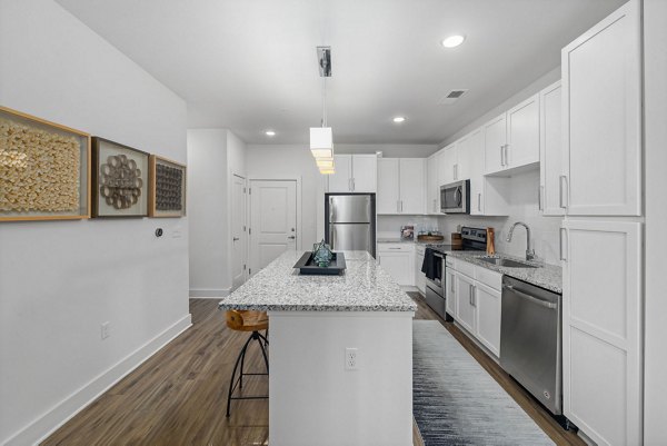 Modern kitchen with stainless steel appliances at Republic Flats Apartments