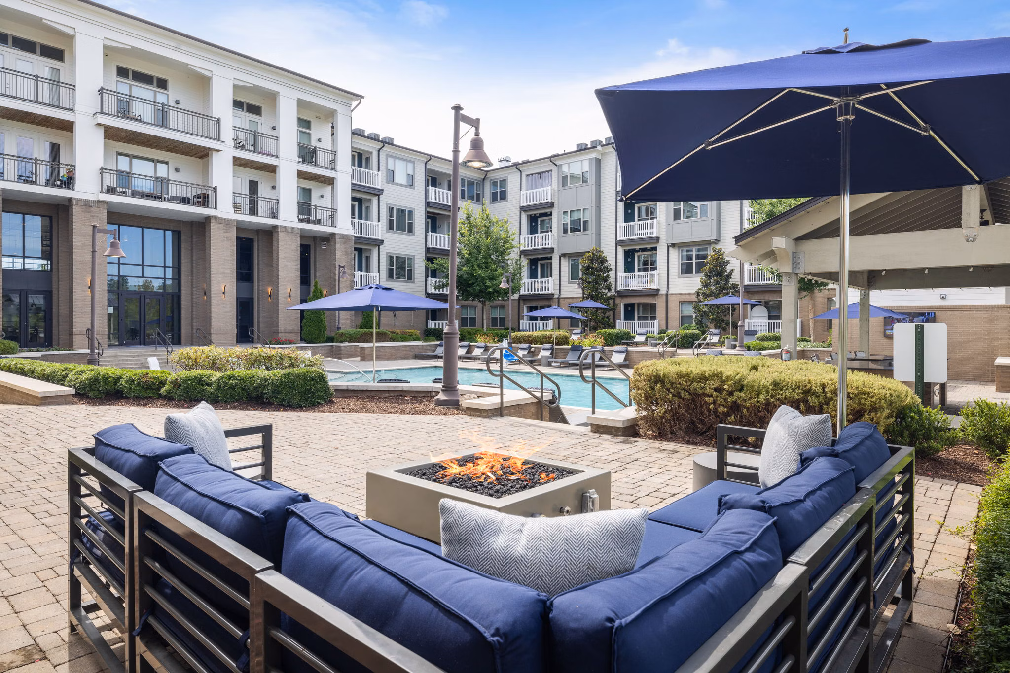Sunny patio with outdoor seating at Republic Flats Apartments offering a relaxed outdoor space for residents to enjoy