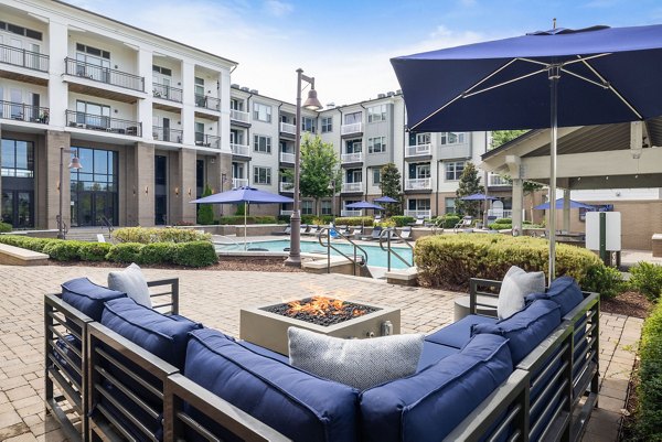 Sunny patio with outdoor seating at Republic Flats Apartments offering a relaxed outdoor space for residents to enjoy