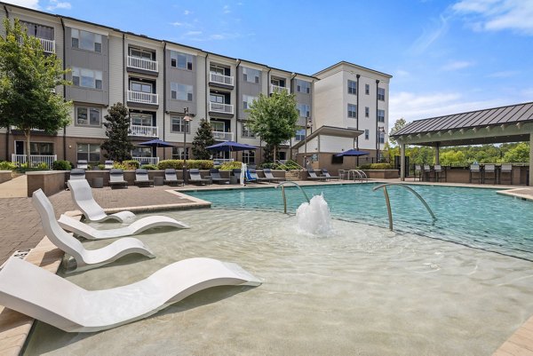 Sparkling outdoor pool at Republic Flats Apartments offering relaxation and stunning views