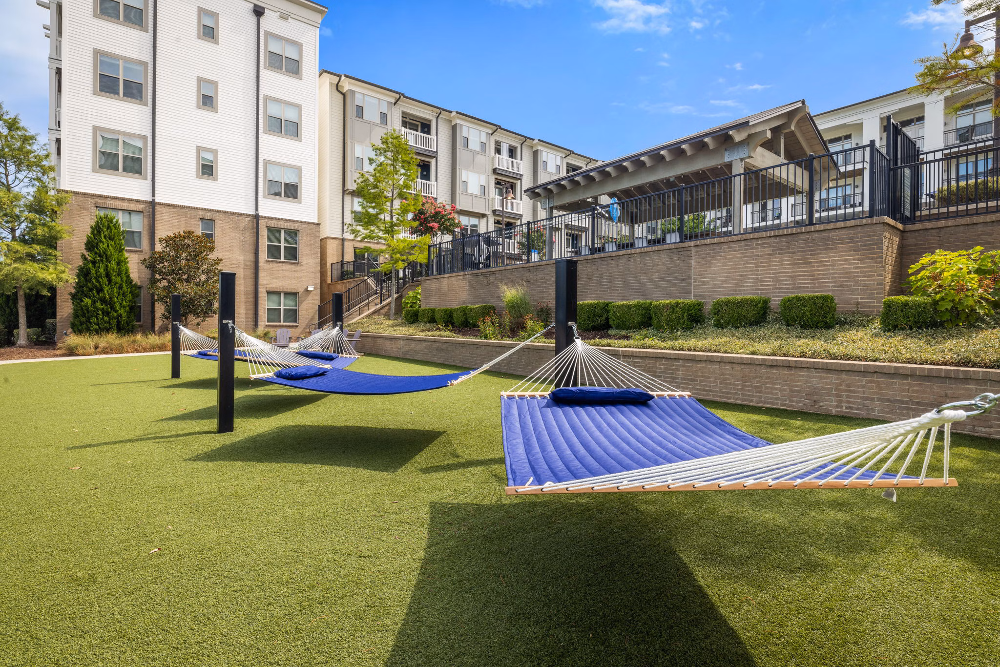 Outdoor recreational area with lush gardens at Republic Flats Apartments