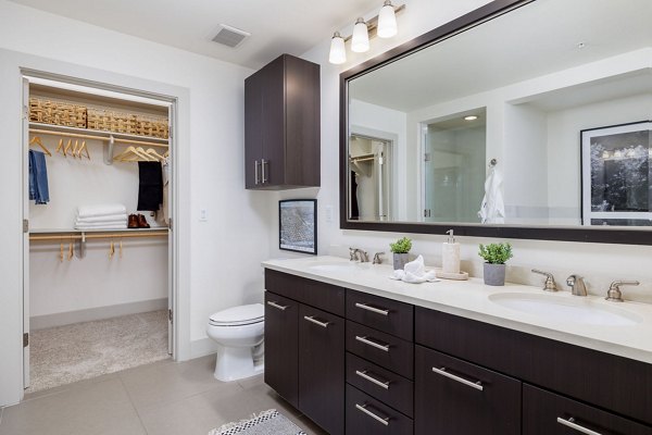 Modern bathroom with sleek fixtures and ample lighting at Northshore Apartments