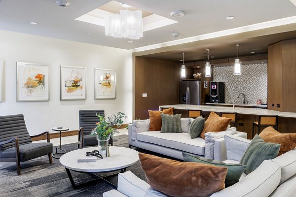 Clubhouse at Northshore Apartments: Modern design featuring spacious seating and greenery in upscale luxury apartments