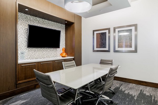 Modern clubhouse with cozy seating and large TV at Northshore Apartments, offering premium amenities for residents