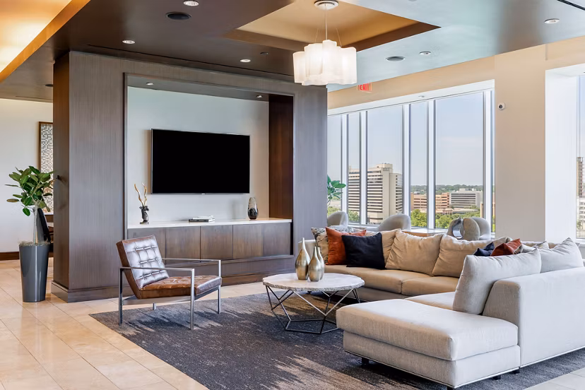 Modern clubhouse with plush seating and pool table at Northshore Apartments, a luxury Greystar property in scenic setting