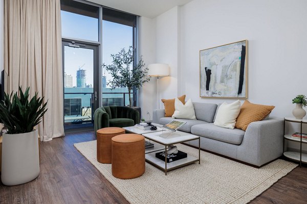 Cozy living room with modern furnishings at Northshore Apartments, ideal for luxury living in Greystar's esteemed property collection