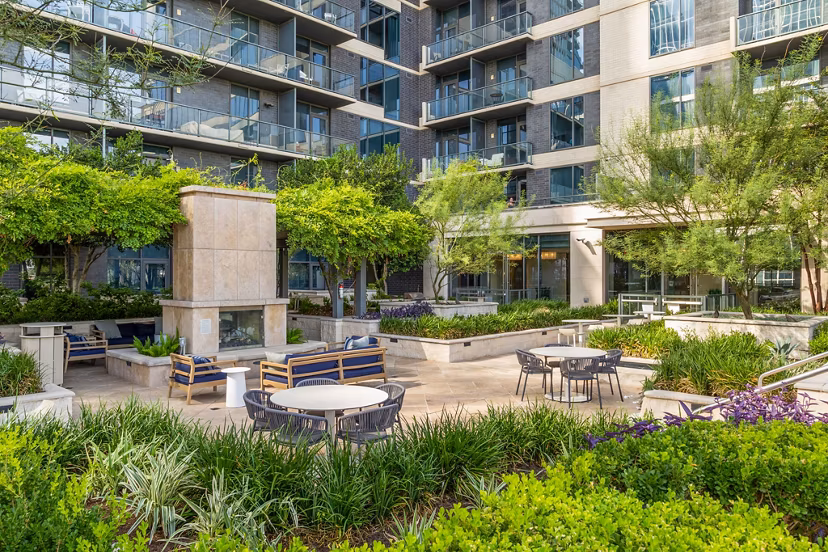 Patio with cozy seating and greenery at Northshore Apartments, a Greystar luxury residence