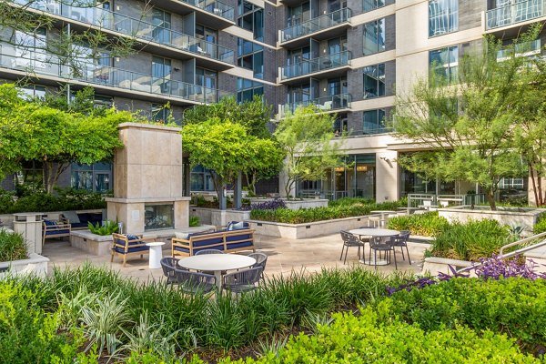 Patio with cozy seating and greenery at Northshore Apartments, a Greystar luxury residence