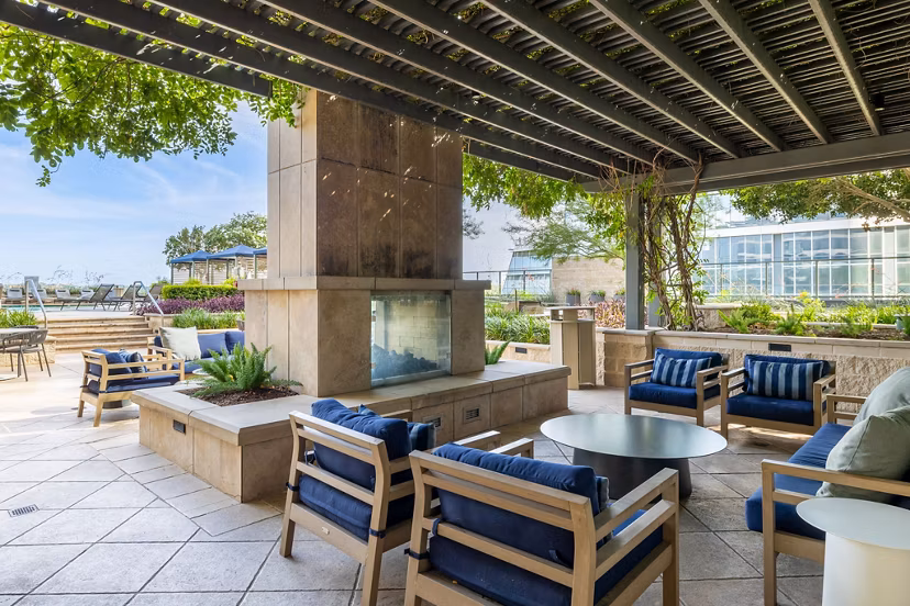 Outdoor patio with a cozy fire pit at Northshore Apartments