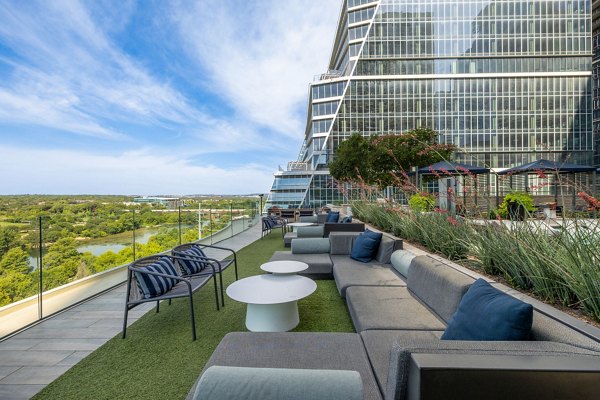Northshore Apartments: Elegant patio area with cozy seating and decorative lighting, offering a luxurious outdoor retreat in urban living