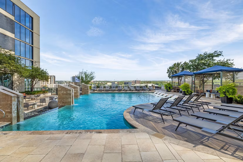 Luxurious outdoor pool with lounging area at Northshore Apartments offering a serene escape for relaxation and recreation