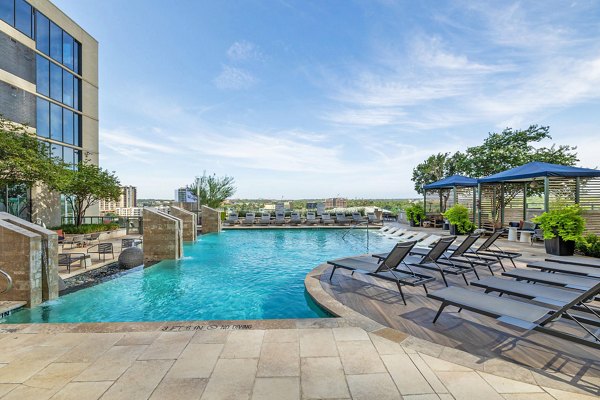 Luxurious outdoor pool with lounging area at Northshore Apartments offering a serene escape for relaxation and recreation
