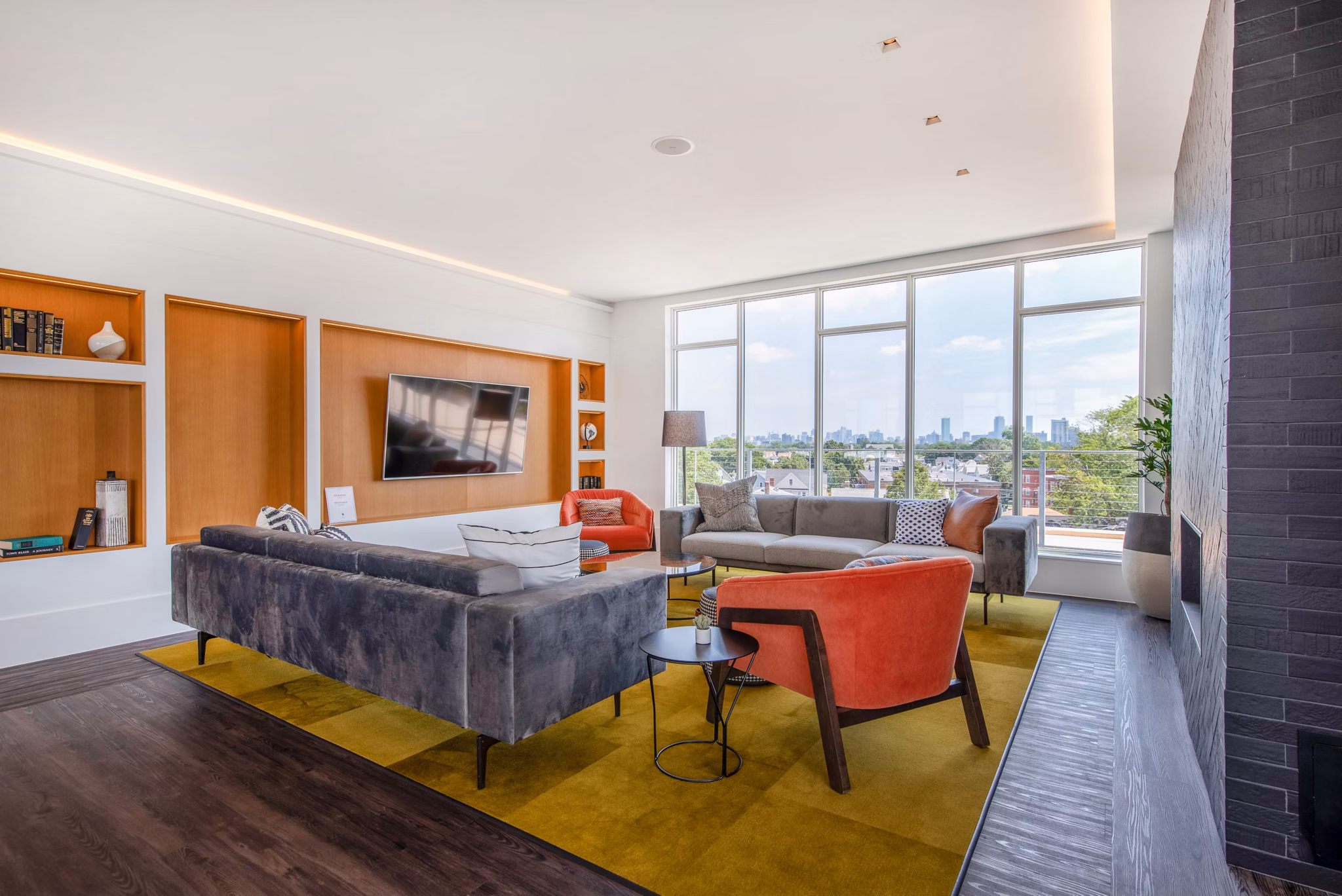 Modern clubhouse with cozy seating and game areas at Radius Apartments, an upscale community