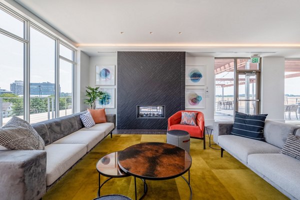 Modern clubhouse featuring a spacious lounge and game area at Radius Apartments