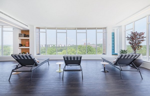 Modern clubhouse with cozy seating and entertainment area at Radius Apartments