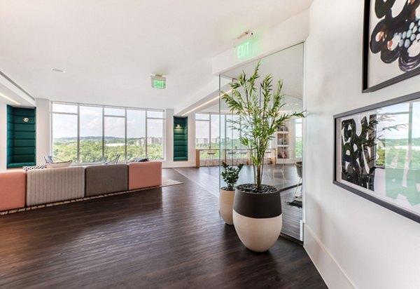 Clubhouse featuring modern design and communal seating at Radius Apartments
